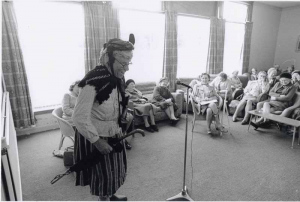 Cailleach an Deacon entertaining at the Lewis Retirement Centre